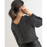 Doppelte schwarze Strickjacke